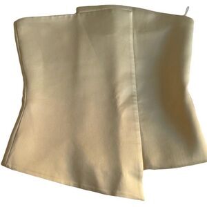 Satin cream strapless but structured top.